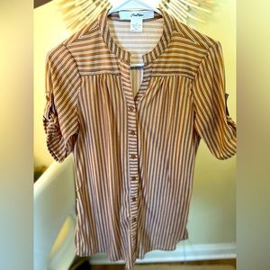 Orange striped shirt. 100% polyester.